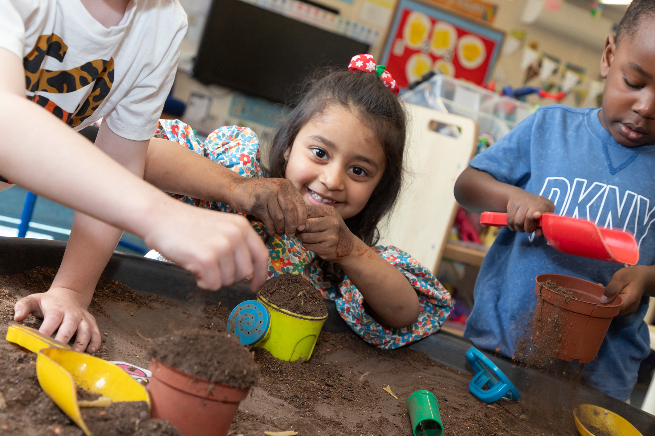 children playing with soil at fairfield preschool